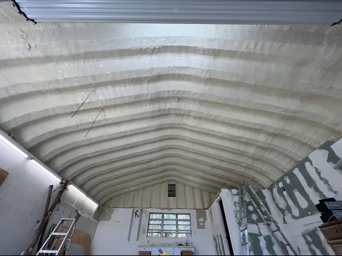 Spray polyurethane foam applied to the underside of a metal roof deck in Eaton